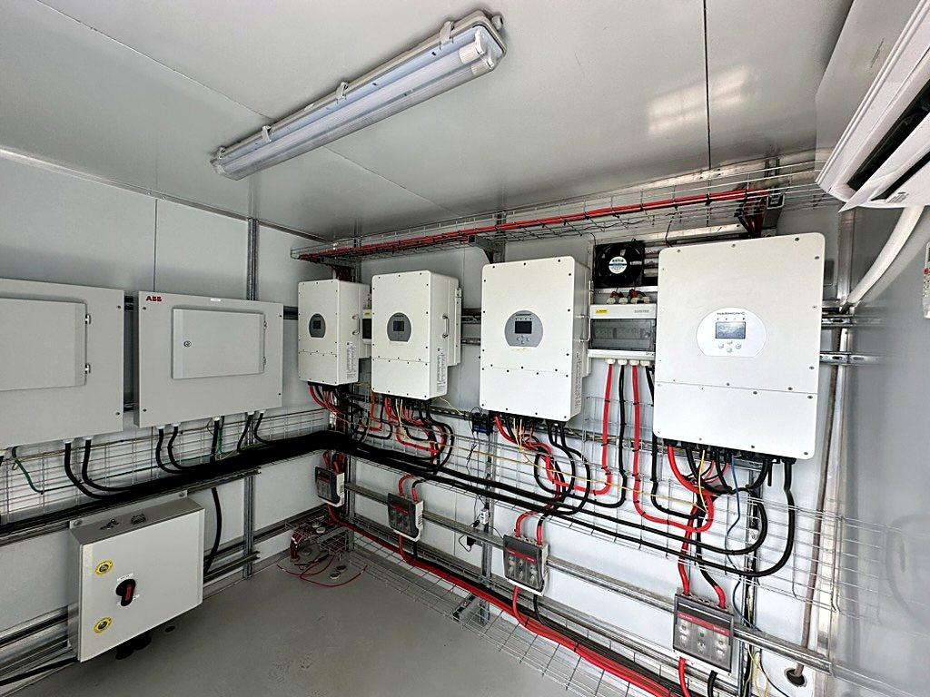 Interior of an electrical control room with inverters and cable management